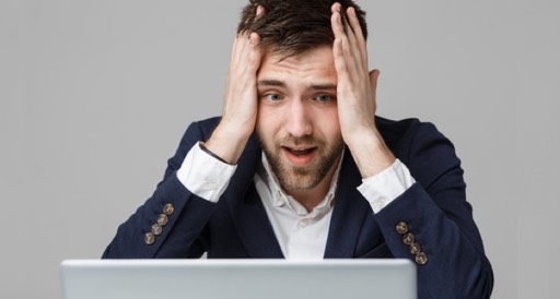 business-concept-portrait-handsome-stressful-business-man-in-suit-shock-looking-at-work-in-laptop-white-background 1258-359